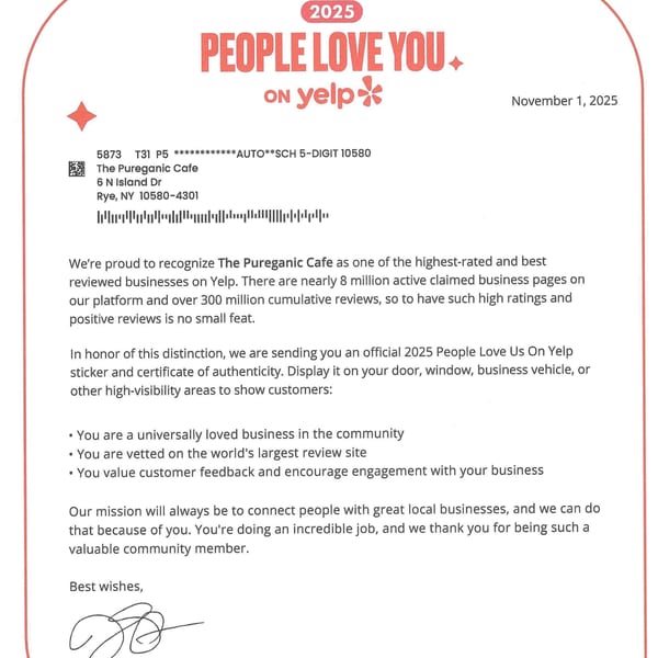 A Yelp letter congratulating The Pureganic Cafe for being a highly-rated business.
